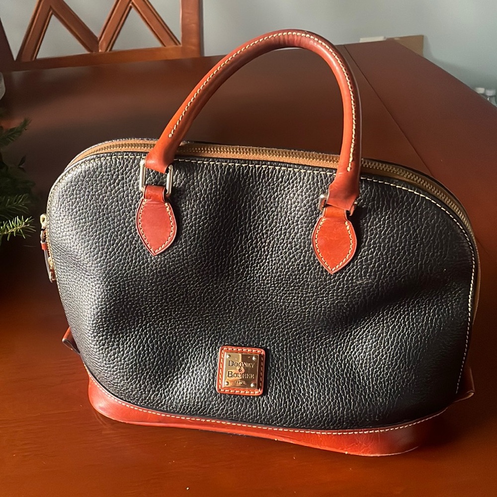 Dooney & Bourke black pocketbook (used).  Very good condition.
